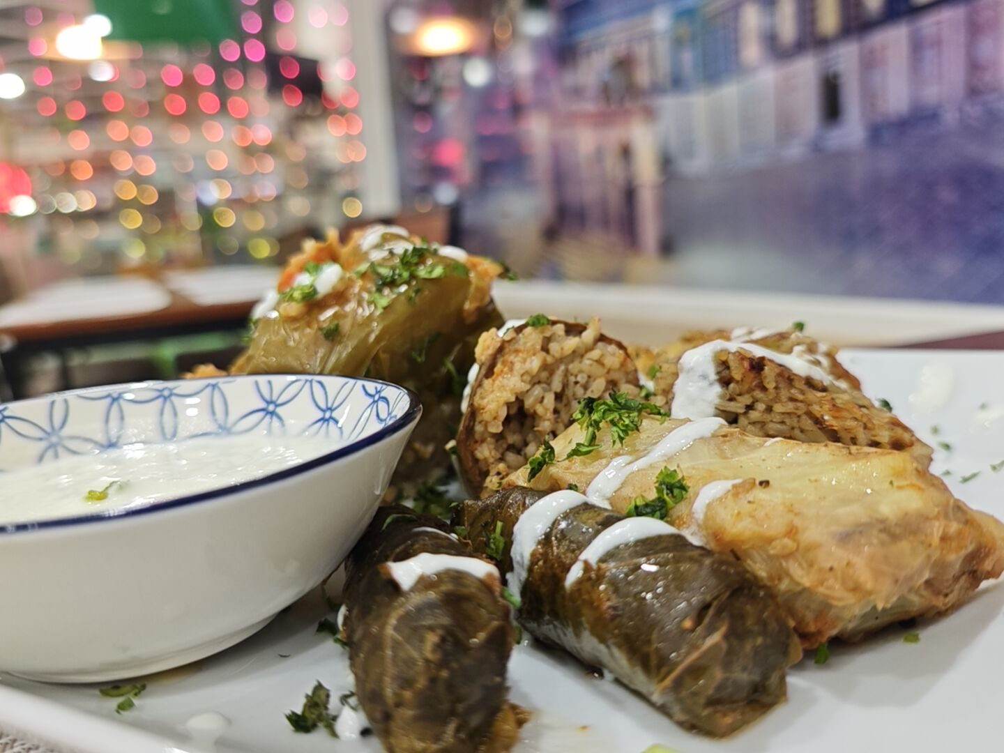 Stuffed dolma alongside a cooling yogurt salad